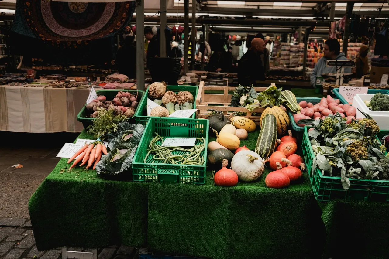 A market stall with crates of fresh produce
